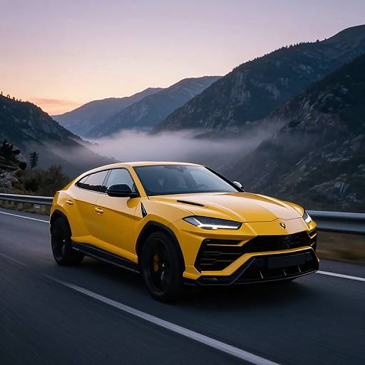 Photograph of a bright yellow Porsche Cayenne speeding on a mountain road at sunrise, surrounded by misty, forested hills.