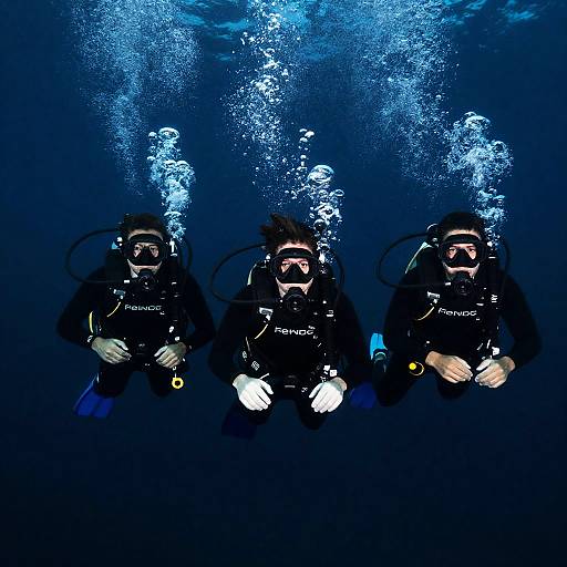 Dramatic Underwater Dive with Scuba Divers