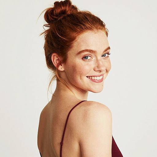 Smiling Redhead Woman Over Shoulder