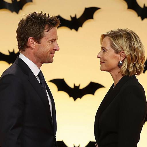 Smiling Couple Against Yellow Bat Background