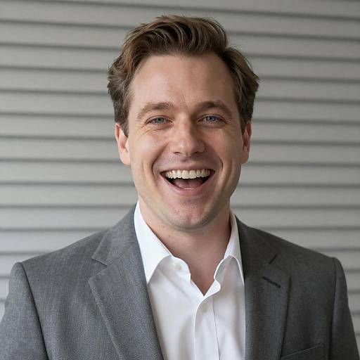 Smiling Businessman in Gray Suit