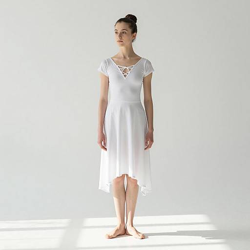 Elegant Young Woman in White Dance Costume