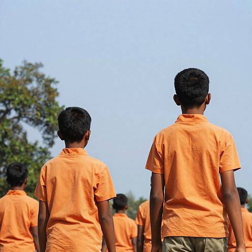 Boys Walking Outdoors Under Blue Sky