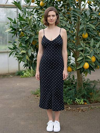 Woman in Polka Dot Dress Greenhouse