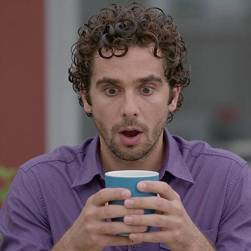 Surprised Man in Purple Shirt