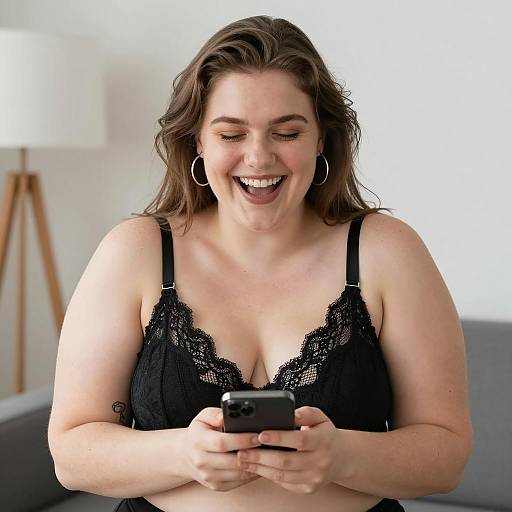 Smiling Plus-Sized Woman Using Smartphone