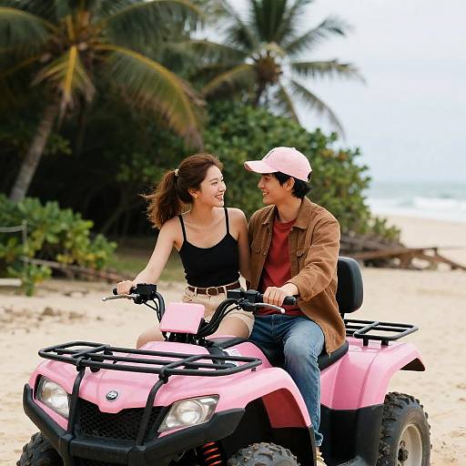 Young Couple Riding Pink ATV on Beach