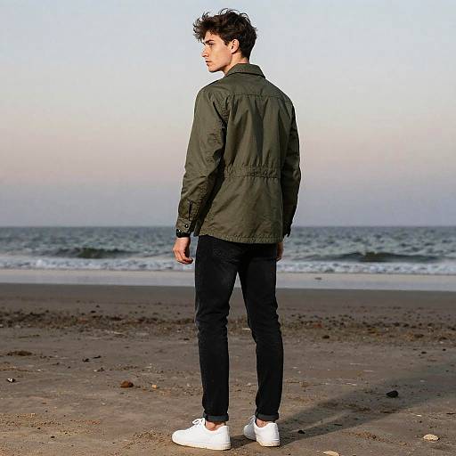 Confident Young Man on Dawn Beach