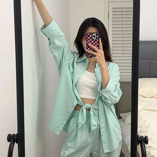 Chic Woman Mirror Selfie in White Room