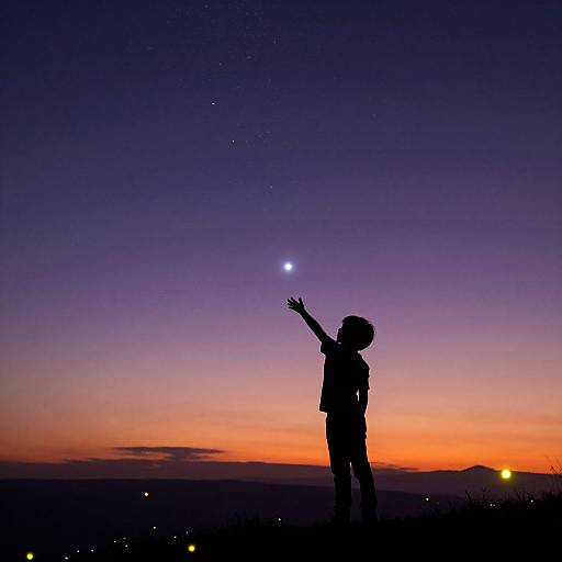 Silhouetted child pointing at a bright star against a vibrant twilight sky, with purple, orange, and blue gradients. Stars and distant lights scatter