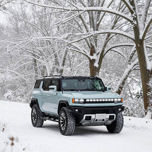 Hummer EV Through Snow-Laden Oaks
