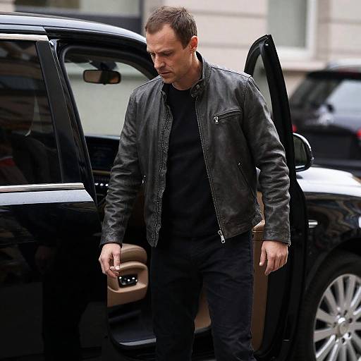 Intense Man Exiting Luxury Car