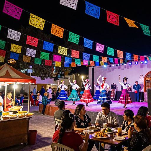 Vibrant Mexican cultural festival scene: Colorful papel picado banners, traditional dancers on stage, people dining at tables, and a food stall.