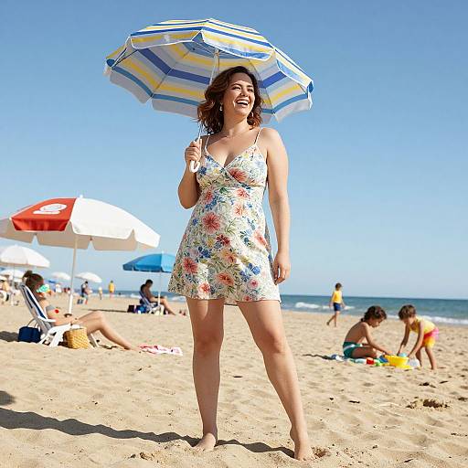 Photograph of a smiling woman in a floral sundress holding a striped beach umbrella on a sunny sandy beach, with other beachgoers in the background