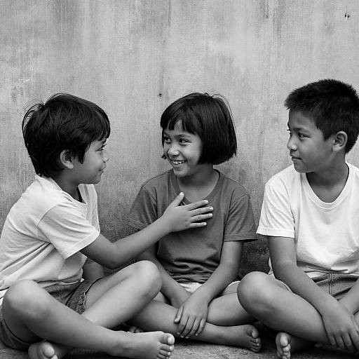 Black and White Photo of Three Kids Sitting