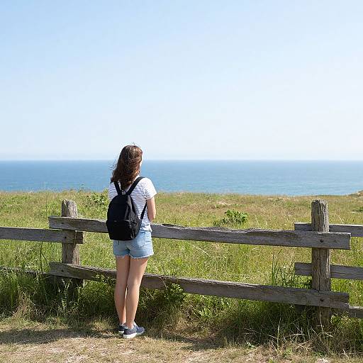 Young Woman by Rural Seaside Fence