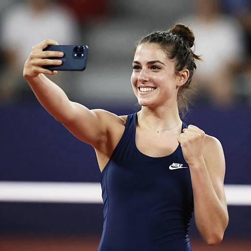 Triumphant Olivia Taking Selfie