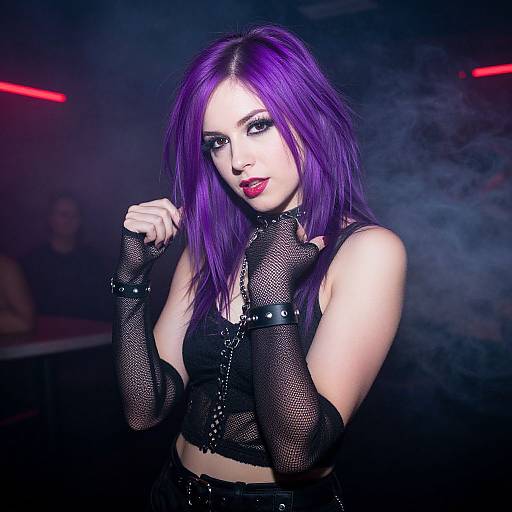 Photograph of a pale-skinned woman with vivid purple hair, wearing black mesh gloves and top, red lipstick, in a smoky, dimly