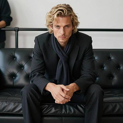 Stylish Man on Leather Couch Portrait