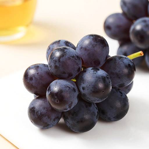 Glossy Dark Purple Grapes with Bokeh