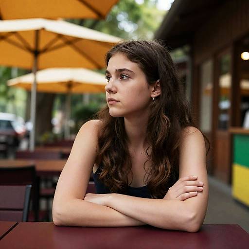 Pensive Woman at Outdoor Café Scene