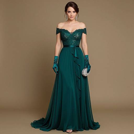 Photograph of a woman in an off-shoulder, teal lace gown with matching gloves, holding a silver clutch, standing against a beige background.