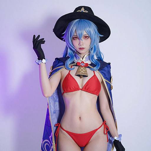 Asian Cosplayer in Blue Hair and Cape