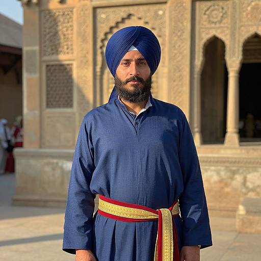 Bearded Man in Turban by Historic Building