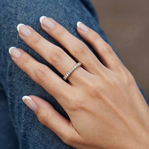 Elegant Hand with Diamond Ring on Denim