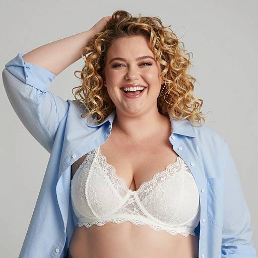 Plus-Sized Woman Smiling in White Lace Bra and Blue Shirt