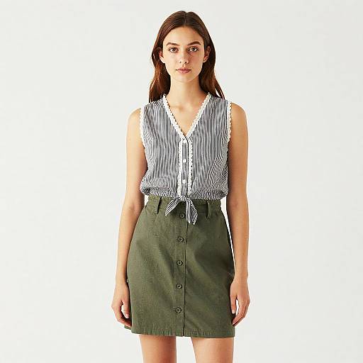 Young Woman in Striped Top and Skirt