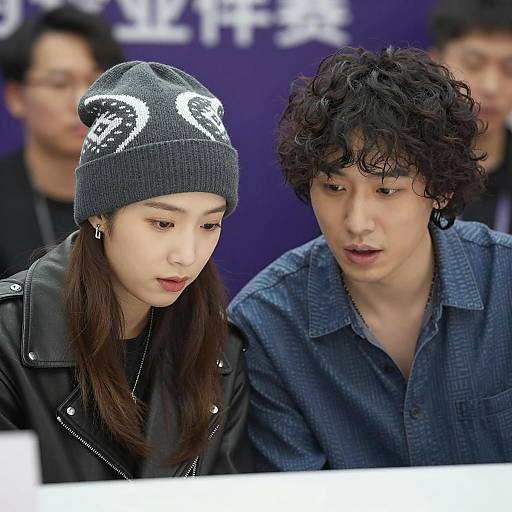 Candid Moment of Two Focused Individuals