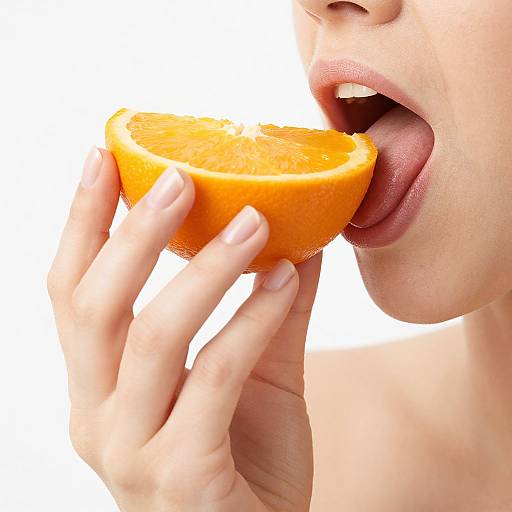 Close-Up Woman Holding Orange Slice