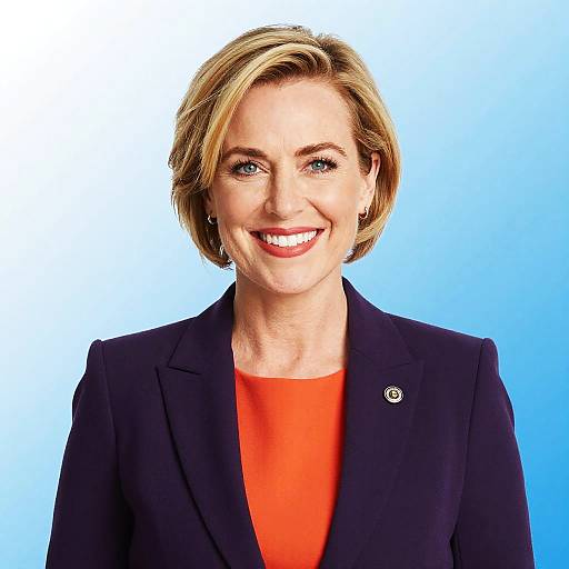 Smiling Woman in Purple Blazer