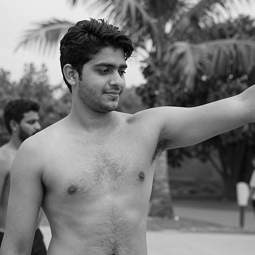 Shirtless Man with Palm Tree Background
