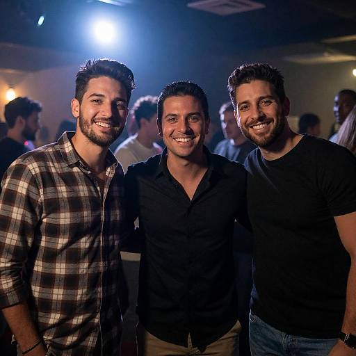 Smiling Friends in Dimly Lit Room