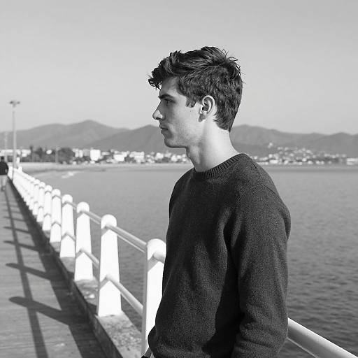 Young Man on Coastal Pier in B&W