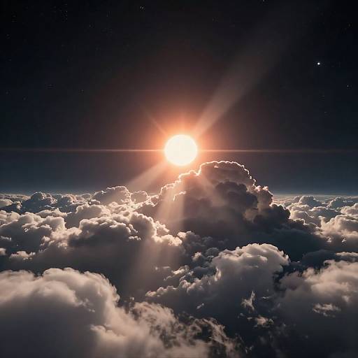 Photograph of a bright sun rising behind a cluster of fluffy, illuminated clouds, with a starry dark blue sky above.