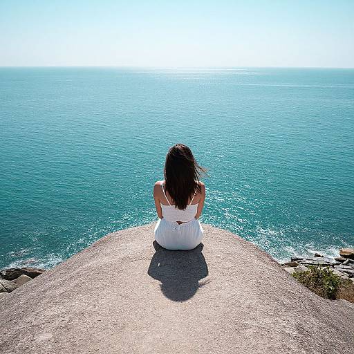 Serene Woman Embracing Ocean Horizon