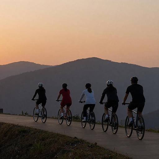 Group Cycling at Sunset on Mountain Path