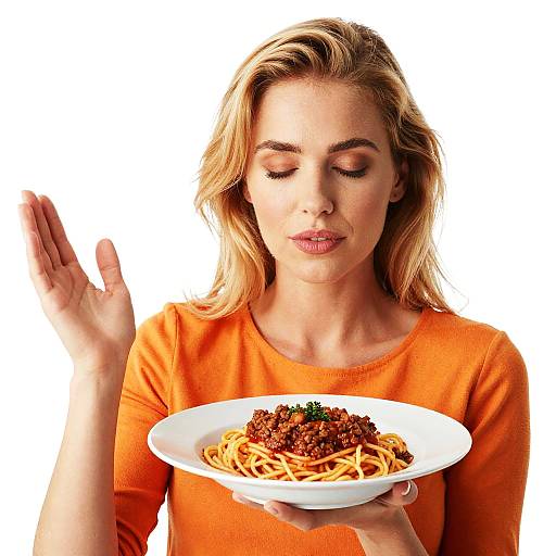 Woman savoring spaghetti bolognese