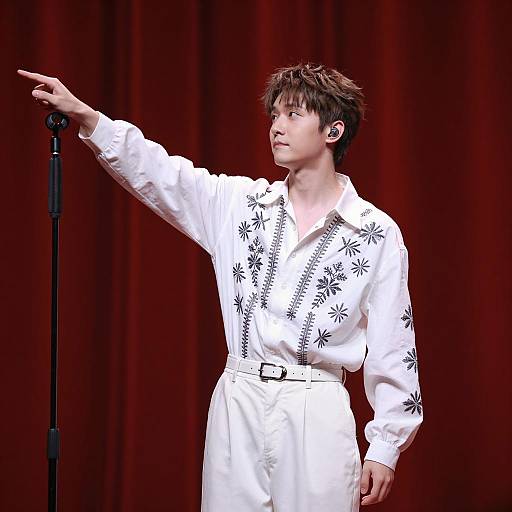 Dynamic Performer in Embroidered Attire