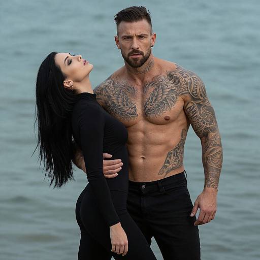 Intense Tattooed Couple by Ocean