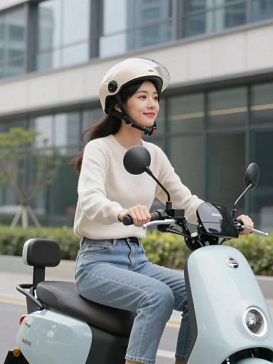 Young Woman Riding Light Blue Scooter