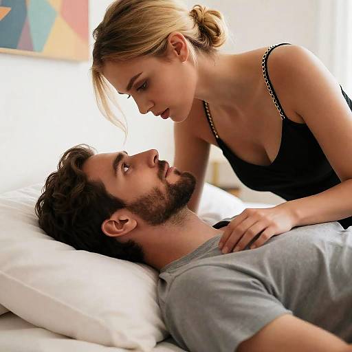 Couple Sharing Intimate Moment on Bed