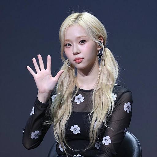 Blonde Woman Waving in Floral Top