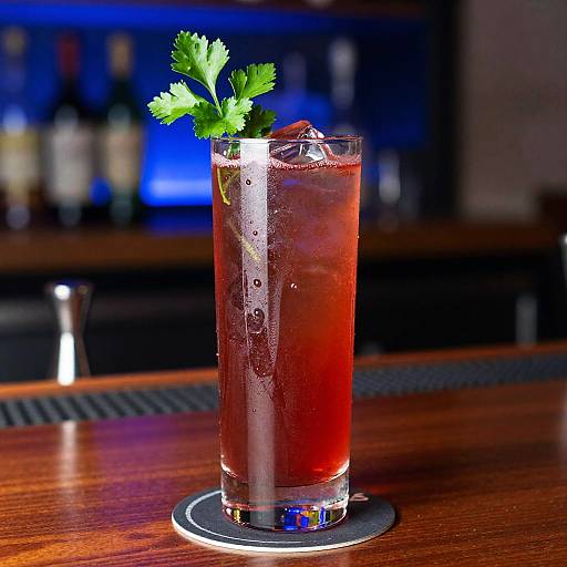 Vibrant Red Cocktail with Parsley Garnish