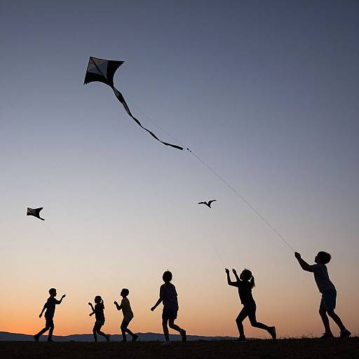 Silhouetted children flying kites against a gradient sunset sky, with three kites in the air, capturing a serene evening moment.