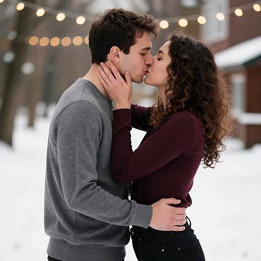 Romantic Winter Kiss Under String Lights