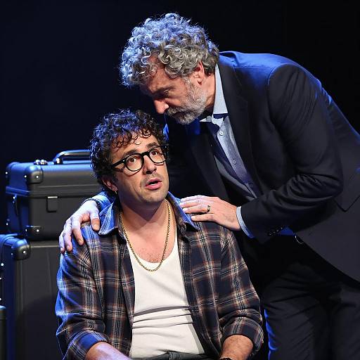 Man in Suit Comforting Surprised Man with Glasses